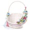 Beautiful floral arrangement on a little baby wicker basket. Floral concept. Easter Basket. Spring colors