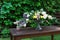 Beautiful flower bouquet outdoors. Wedding floristic decoration at wooden table