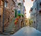 Beautiful flower street in a medieval village in Tuscany.