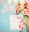 Beautiful flowers bunch with empty greeting card ,ribbon and bokeh on blue shabby chic background