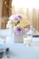 Beautiful flowers and candles on table in wedding day.Blue color decoration tablecloth