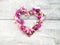 beautiful flowers heart shape for valentine on wood background