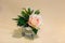 Beautiful flowers in vases on table close up. Bouquet of blooming summer flowers. Excellent buttercup flowers in glass vase on wo