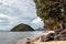 Beautiful fluffy clouds on a blue sky flying over a sandy paradise beach on a tropical island in El Nido Palawan the Philippines