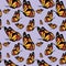 Beautiful flying and sitting butterflies monarch on light purple background seamless pattern.