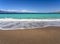 Beautiful foamy waves on the beach Psatha in the Corinthian Gulf and the Ionian sea in Greece