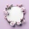 Beautiful Focused on the circle frame from white and purple rose and branches, isolation, plain soft baby pink copyspace