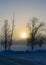 Beautiful fog morning, sun through fog, silhouettes of trees and branches, winter landscape, blurred smok