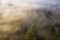 Beautiful foggy morning landscape of river view from above. Aerial view of clouds over river