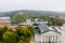 Beautiful foggy Vilnius city scene in autumn with orange and yellow foliage. Aerial early morning view