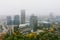 Beautiful foggy Vilnius city scene in autumn with orange and yellow foliage. Aerial early morning view