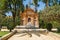 Beautiful fontain in the Alcazar fortress wall. Monument Catalina Ribeira, tiled portrait and Seville Ladies