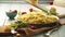 Beautiful food footage: a cook grates cheese on the plate of freshly-cooked spaghetti