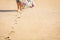 A Beautiful foot footprints in the sand killing on nature background