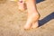 A Beautiful foot footprints in the sand killing on nature background