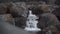 Beautiful footage the water of Dardagna waterfalls cascading on rocks, Bologna Region, Italy