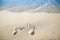 beautiful footprints in the sand near the sea on nature background