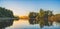 Beautiful forest lake in the evening sunlight. Panorama