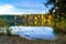 Beautiful forest lake old quarry on a clear autumn day