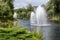 Beautiful fountains on lake in formal garden