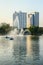 Beautiful fountains in the lake at Lumpini Park, Bangkok Thailand. Tranquil public park garden with pond, fountain, and boats in