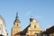 Beautiful Franciscan Monastery in Pilsen, Czech Republic with light blue sky in background. The church and monastery are among the