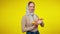 Beautiful freckled redhead woman in kerchief holding egg tray looking at camera and smiling. Portrait of charming slim