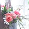 Beautiful fresh flowers in a wooden box, natural light setting