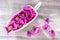 Beautiful fresh medical opium poppy calendula flowers in basket on wooden old table