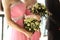 Beautiful fresh roses in wedding bouquet in bridesmaids hands cl