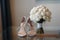 Beautiful fresh wedding bouquet with bride`s shoes