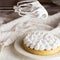 Beautiful freshly made white lemon meringue tart on plate. Lemon meringue pie still life composition. Food photo