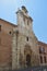 Beautiful Front Facade Of The Church Of Alcala De Henares University With A Nest Of Storks In Its Old Bell Tower. Architecture Tra