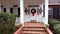 Beautiful front porch of house decorated for Christmas