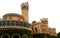 Beautiful front view with battlement towers of bangalore palace with creeper plant.