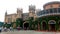 Beautiful front view with battlement towers of bangalore palace with creeper plant.