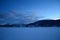 Beautiful frozen river and mountain landscape in the high north winter