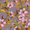 Beautiful fruit tree twigs in bloom on gray background. Pink flowers and yellow leaves. Spring blossom. Seamless floral pattern.