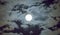 Beautiful full moon and white cloudy sky background in the midnight sky background, moonlight on Halloween night without stars.