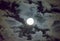 Beautiful full moon and white cloudy sky background in the midnight sky background, moonlight on Halloween night without stars.