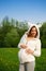 Beautiful funny pregnant woman in a suit lamb