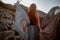 Beautiful furious scandinavian warrior ginger woman in grey dress