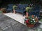 Beautiful garden benches painted gray and flowers to decorate