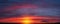 Beautiful gentle sunset panorama with large clouds