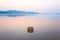 Beautiful gently river at sunrise, bamboo basket for washing veg