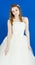 Beautiful gfirl bride on blue background. dress