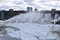 Beautiful gigantic frozen Niagara Waterfalls on a frozen spring day in Niagara Falls in Ontario, Canada