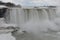 Beautiful gigantic frozen Niagara Waterfalls on a frozen spring day in Niagara Falls in Ontario, Canada