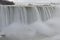 Beautiful gigantic frozen Niagara Waterfalls on a frozen spring day in Niagara Falls in Ontario, Canada