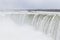 Beautiful gigantic frozen Niagara Waterfalls on a frozen spring day in Niagara Falls in Ontario, Canada